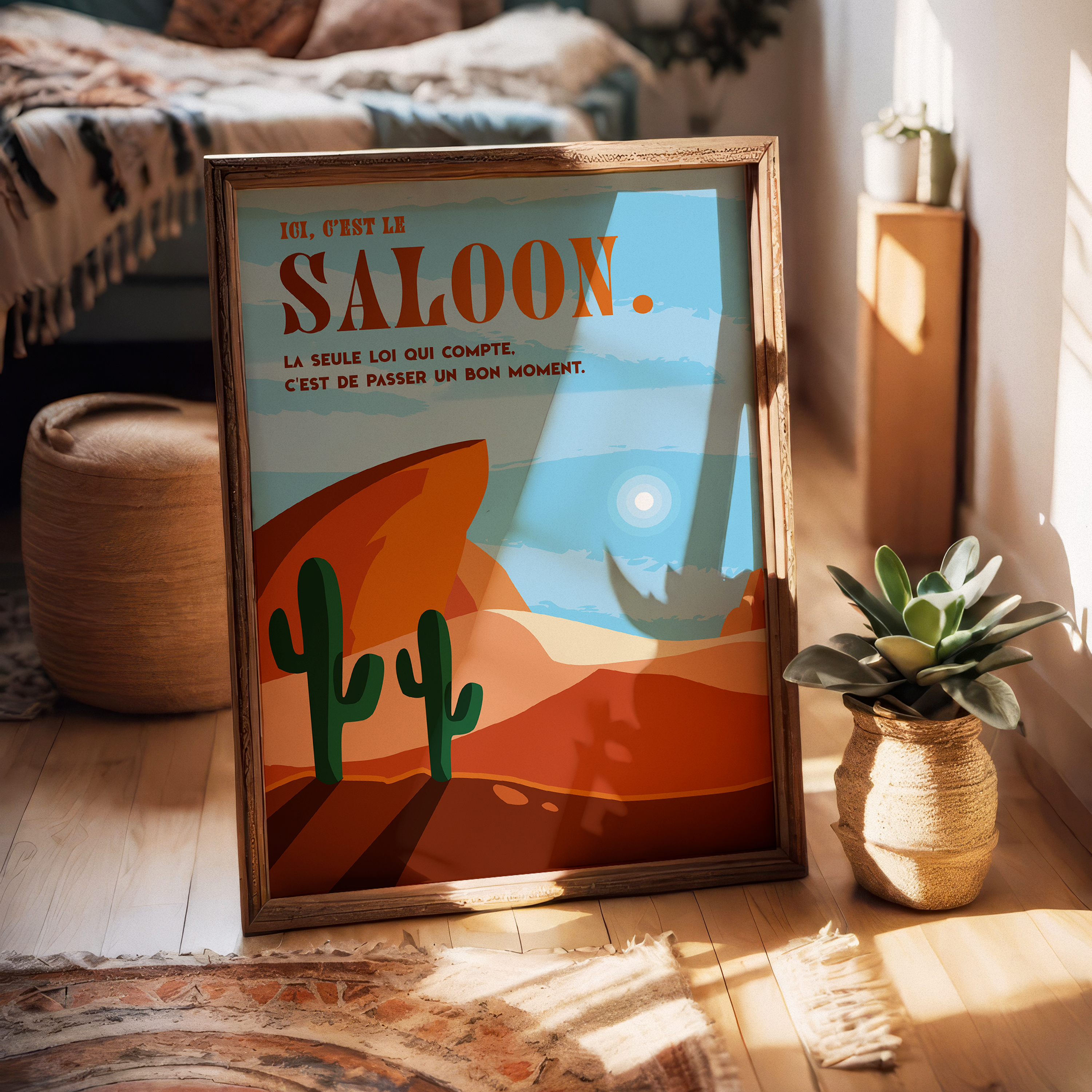 Affiche déco style western avec désert, cactus et rochers rouges, inscription “Ici, c’est le saloon. La seule loi qui compte, c’est de passer un bon moment.”, décoration murale vintage Far West pour salon, bar, bureau ou salle de jeux.