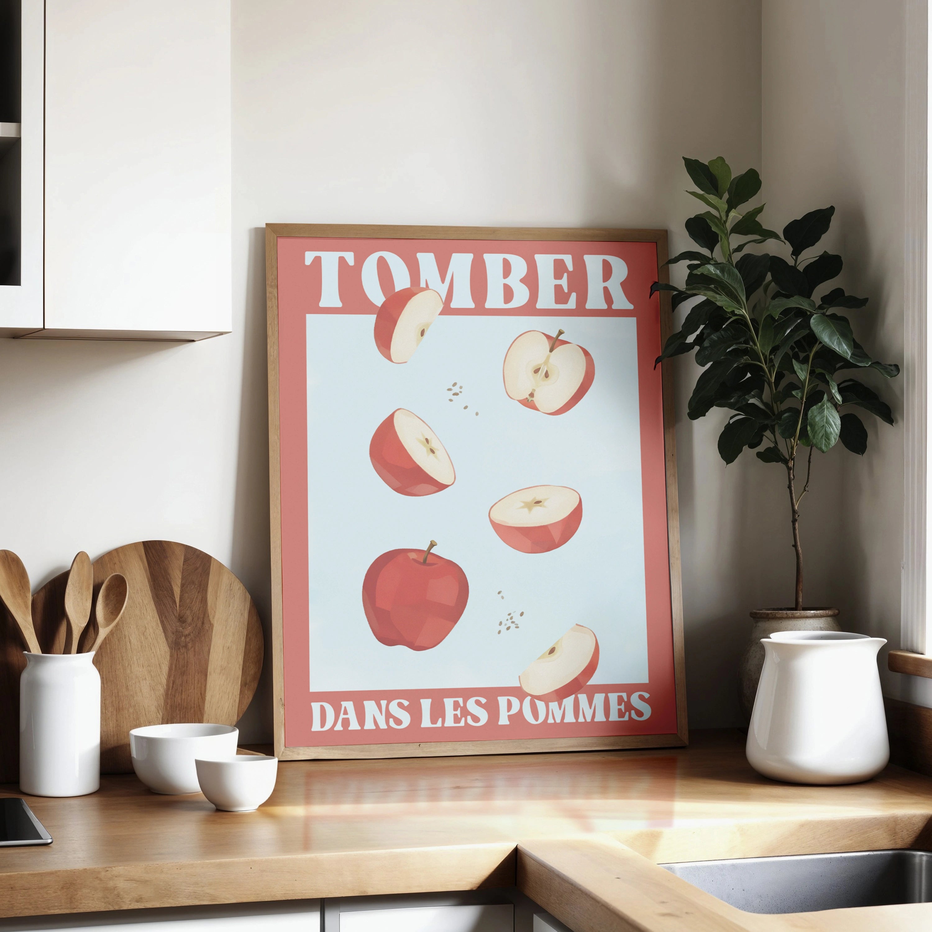 Affiche illustrée avec des pommes rouges en chute libre, accompagnée du texte français 'Tomber dans les pommes', une expression idiomatique signifiant s’évanouir. Illustration humoristique sur fond bleu clair, encadrée de rouge, parfaite pour une décoration murale ou une communication visuelle en lien avec la langue française ou les expressions idiomatiques.